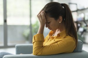 Depressed lonely woman sitting at home