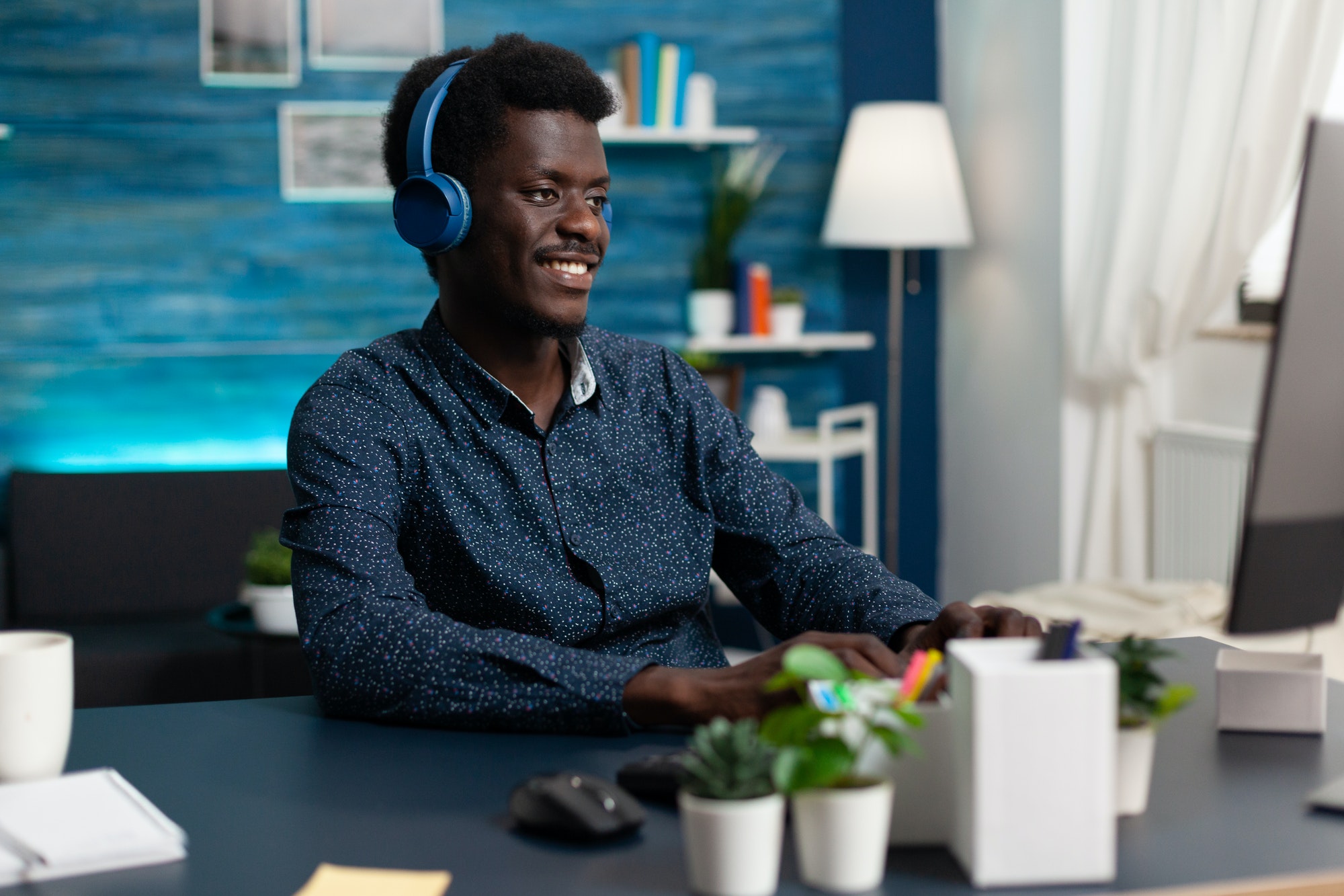 Smiling student wearing headphone listening music
